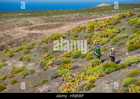 tourist walking at path at coastal path at el juncal, gran canaria, spain Stock Photo