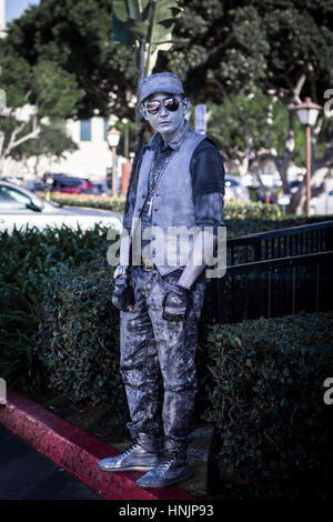 live statue man busking and entertaining on the streets Stock Photo