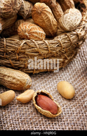 Dried peanuts in wicker basket Stock Photo