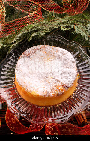 Traditional christmas cheese cake on wooden background Stock Photo