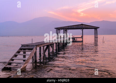 Lago de Coatepeque ('Lake Coatepeque') is a beautiful freshwater lake situated in a volcanic caldera located in Santa Ana, El Salvador. Stock Photo