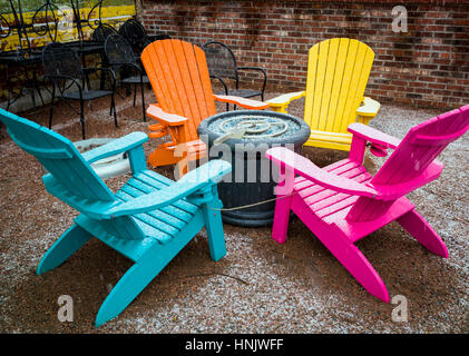 Colorful outdoor chairs in snow on patio of Boathouse Cantina restaurant; Salida; Colorado: USA Stock Photo