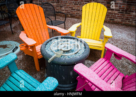 Colorful outdoor chairs in snow on patio of Boathouse Cantina restaurant; Salida; Colorado: USA Stock Photo