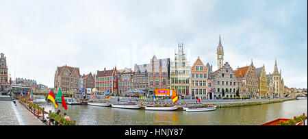 GHENT, BELGIUM - MAY 26, 2011: Panorama of the Graslei Quay, occupied with the picturesque stepped gable mansions and guild houses, numerous pleasure  Stock Photo