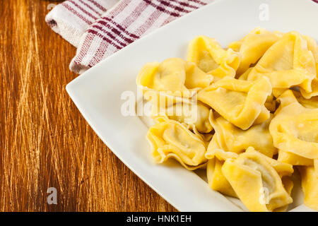 Tortellini shells filled with chesse Stock Photo