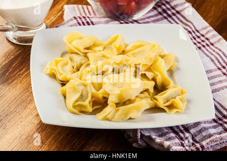 Tortellini shells filled with chesse Stock Photo