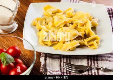 Tortellini shells filled with chesse Stock Photo