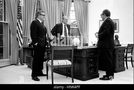 U.S President Gerald Ford meets with Secretary of State Henry Kissinger, right, and Vice President Nelson Rockefeller to discuss the American evacuation of Saigon in the Oval Office of the White House April 28, 1975 in Washington, DC. Stock Photo