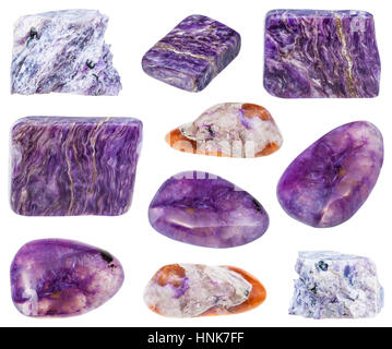 collection of various tumbled and raw charoite mineral stones isolated on white background Stock Photo