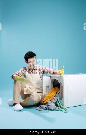 Young men do housework Stock Photo