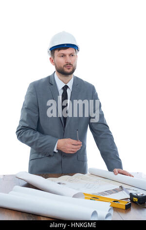 Professional builder reading architecture plan and analyzing. Stock Photo
