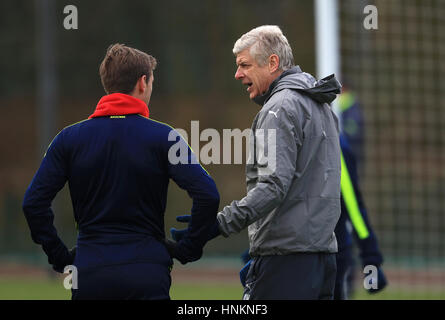 Arsenal manager Arsene Wenger speaks to Nacho Monreal during a training session at London Colney, Hertfordshire. Stock Photo