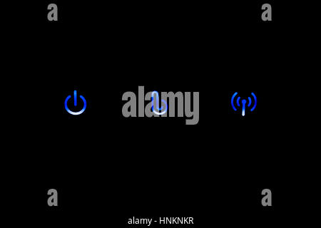 The three blue lights on an internet router box. Stock Photo