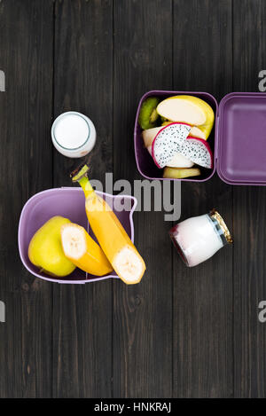 Vertical photo of fruits lying in boxes Stock Photo