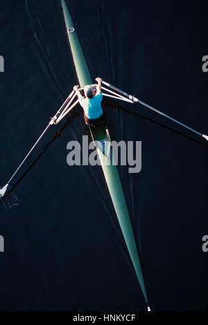 Sculling Rowing Overhead Image A man sculling in a single scull rowing boat, on the water. Overhead ...