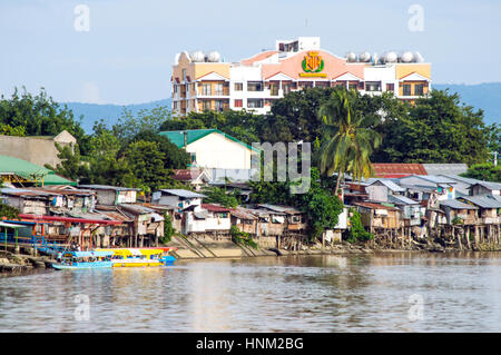 Slum housing along Bangkerohan River, Davao, Davao Del Sur, Philippines Stock Photo