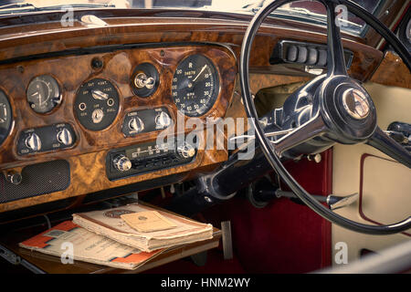 Vintage car dashboard with walnut and chrome Stock Photo