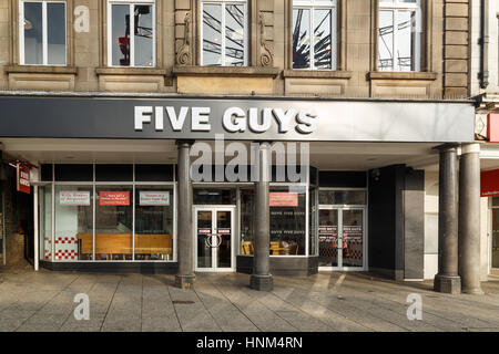 NOTTINGHAM, ENGLAND - FEBRUARY 13: Exterior of 'Five Guys' burger restaurant in Nottingham. In Nottingham, England. On 13th February 2017. Stock Photo