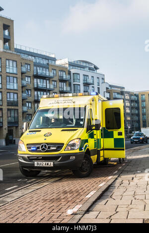 A London ambulance attends to injured cyclist in Brentford, west London, England, UK Stock Photo