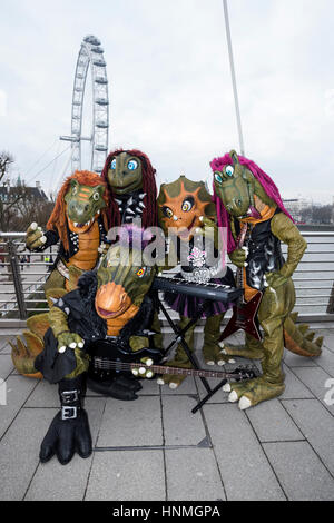 London, UK. 14 February 2017. Finnish heavy metal dinosaur band Hevisaurus busk on Golden Jubilee Bridge and the Southbank ahead of their London premiere in the Royal Festival Hall on 15 February, as part of Southbank Centre's Imagine Children's Festival (until 19 February). Stock Photo