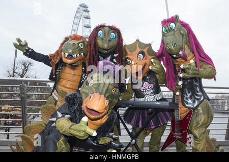 London, UK. 14 February 2017. Finnish heavy metal dinosaur band Hevisaurus busk on Golden Jubilee Bridge and the Southbank ahead of their London premiere in the Royal Festival Hall on 15 February, as part of Southbank Centre's Imagine Children's Festival (until 19 February). Stock Photo