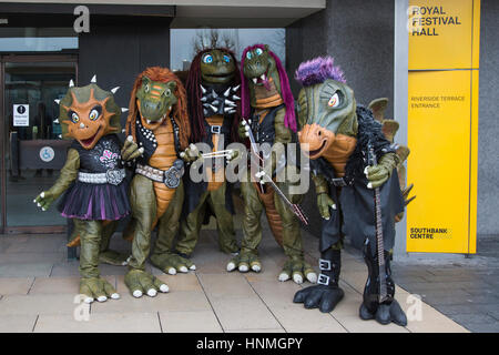 London, UK. 14 February 2017. Finnish heavy metal dinosaur band Hevisaurus busk on Golden Jubilee Bridge and the Southbank ahead of their London premiere in the Royal Festival Hall on 15 February, as part of Southbank Centre's Imagine Children's Festival (until 19 February). Stock Photo