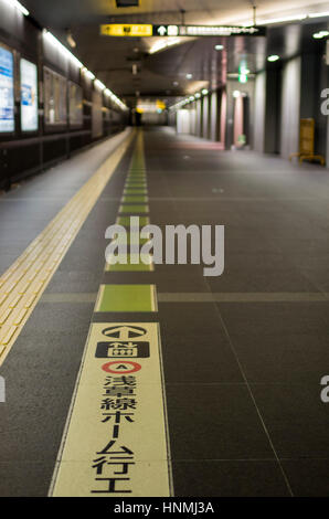 Marking s on the floor at the subway station in Tokyo, Japan. Stock Photo