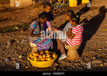 Local Children Selling Mangoes By The Side Of The Road, Arba Minch, Ethiopia Stock Photo