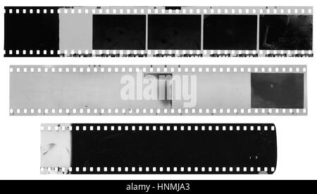 Old, used, dusty and scratched black and white celluloid film strips isolated on white background Stock Photo