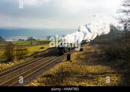 Ribblesdale, North Yorkshire, UK. 14th Feb, 2017. Steam locomotive Tornado hauls a train through Ribblesdale on the Settle-Carlisle line. This is the first day of steam-hauled scheduled services on the national rail network since 1968. Services continue on Wednesday and Thursday. The A1 Class Tornado 60163, completed in 2008, is the first main line steam engine to be built in the UK since the 1960s. Credit: Jon Sparks/Alamy Live News Stock Photo