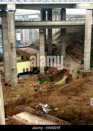 Chongqing, Chongqing, China. 14th Feb, 2017. Chongqing, CHINA-February 14 2017: (EDITORIAL USE ONLY. CHINA OUT) .A house is built under the overpass in southwest China's Chongqing, February 14th, 2017. Credit: SIPA Asia/ZUMA Wire/Alamy Live News Stock Photo