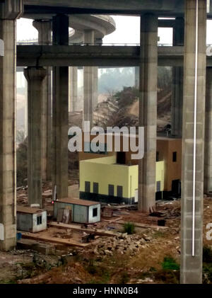 Chongqing, Chongqing, China. 14th Feb, 2017. Chongqing, CHINA-February 14 2017: (EDITORIAL USE ONLY. CHINA OUT) .A house is built under the overpass in southwest China's Chongqing, February 14th, 2017. Credit: SIPA Asia/ZUMA Wire/Alamy Live News Stock Photo