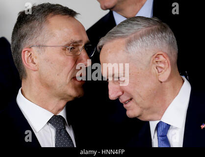 Brussels, Belgium. 15th Feb, 2017. NATO Secretary General Jens Stoltenberg (L) talks with U.S. Defense Secretary James Mattis during the group photo session at a NATO Defence Ministers Meeting at its headquarters in Brussels, Belgium, Feb. 15, 2017. Credit: Ye Pingfan/Xinhua/Alamy Live News Stock Photo