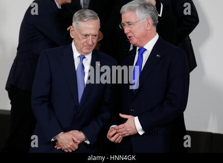 Brussels, Belgium. 15th Feb, 2017. U.S. Defense Secretary James Mattis (L) talks with his British counterpart Michael Fallon during the group photo session at a NATO Defence Ministers Meeting at its headquarters in Brussels, Belgium, Feb. 15, 2017. Credit: Ye Pingfan/Xinhua/Alamy Live News Stock Photo