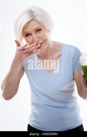 Surprised mature woman pulling a face