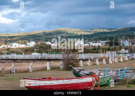 scenic of fishermen village in Quebec country  with abandoned fishing boats Stock Photo