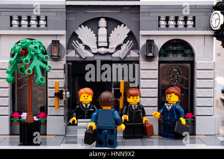 Tambov, Russian Federation - January 21, 2017 Lego businessmen and businesswoman are on the street at the entrance to the Lego bank. Studio shot. Stock Photo