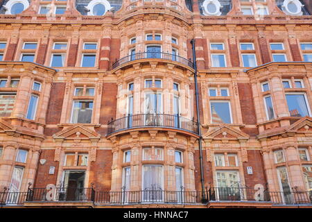 LONDON, UK - FEBRUARY 13, 2017: Red brick Victorian houses facades in Mount Street (borough of Westminster) Stock Photo