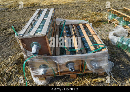 High-voltage insulators of glass insulators. Installation of high-voltage power lines. Stock Photo