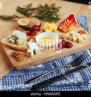 plate with blue cheese Dor, parmesan, Brie Stock Photo