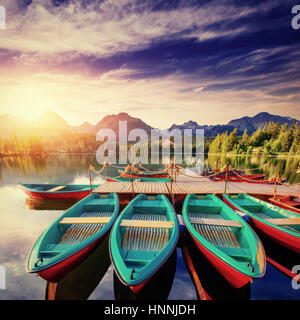 Boat on the dock surrounded mountains. Fantastic Shtrbske Pleso  Stock Photo