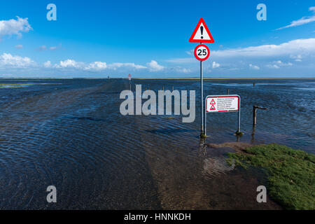 High tide coming in on the road from Mandoe Island to the mainland, Danish Wadden Sea, UNECSCO World Natural Heritage, North Sea, South Jutland, Denma Stock Photo