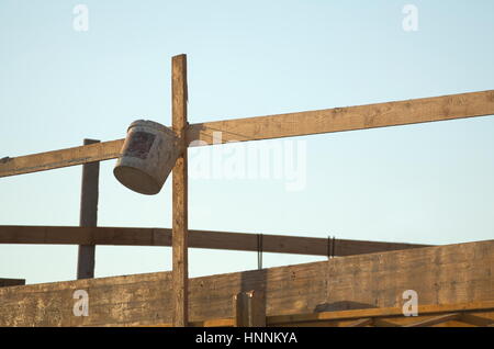 Lath and Bucket on the Construction Site Sunny Early Morning Stock Photo