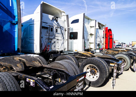 Indianapolis - Circa February 2017: Colorful Semi Tractor Trailer Trucks Lined up for Sale IV Stock Photo