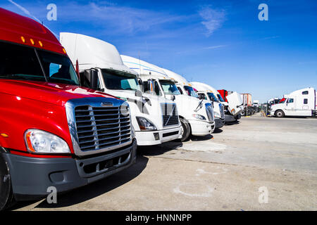 Indianapolis - Circa February 2017: Colorful Semi Tractor Trailer Trucks Lined up for Sale V Stock Photo