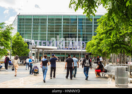 NEW YORK CITY - JUNE 6, 2014: View outside the Staten Island Ferry Terminal Building in downtown Manhattan with people visible. Stock Photo