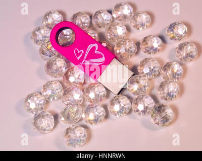 The pink USB flash drive with heart and gems Stock Photo