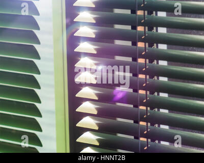 The sun is shining through the blinds Stock Photo