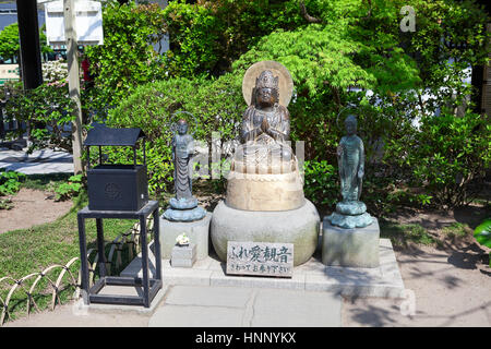 KAMAKURA, JAPAN - CIRCA APR, 2013: Statues of praying Buddhas are in Jizo-do hall in the Hasedera shrine. The Hase-kannon (Hase-dera) is one of the Bu Stock Photo