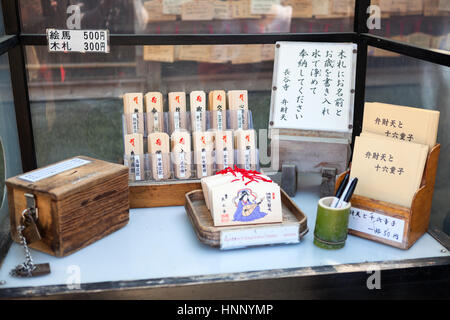 KAMAKURA, JAPAN - CIRCA APR, 2013: Showcase with fortune wooden plates is in the Hasedera shrine. The Hase-kannon (Hase-dera) is one of the Buddhist t Stock Photo